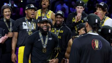 LAS VEGAS, NEVADA - DECEMBER 09: LeBron James #23 of the Los Angeles Lakers celebrates with the MVP trophy after winning the championship game of the inaugural NBA In-Season Tournament at T-Mobile Arena on December 09, 2023 in Las Vegas, Nevada. NOTE TO USER: User expressly acknowledges and agrees that, by downloading and or using this photograph, User is consenting to the terms and conditions of the Getty Images License Agreement. (Photo by Ethan Miller/Getty Images)
