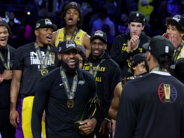 LAS VEGAS, NEVADA - DECEMBER 09: LeBron James #23 of the Los Angeles Lakers celebrates with the MVP trophy after winning the championship game of the inaugural NBA In-Season Tournament at T-Mobile Arena on December 09, 2023 in Las Vegas, Nevada. NOTE TO USER: User expressly acknowledges and agrees that, by downloading and or using this photograph, User is consenting to the terms and conditions of the Getty Images License Agreement. (Photo by Ethan Miller/Getty Images)