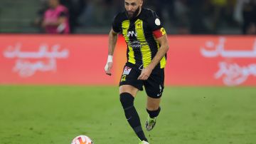 Ittihad's French forward #09 Karim Benzema runs with the ball during the Saudi Pro League football match between Al-Ittihad and Al-Nassr at King Abdullah Sports City Stadium in Jeddah on December 26, 2023. (Photo by AFP) (Photo by -/AFP via Getty Images)