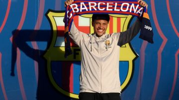 Brazilian forward Vitor Roque poses for photographs during his official presentation as new player of FC Barcelona at the Joan Gamper training ground in Sant Joan Despi, near Barcelona, on December 27, 2023. (Photo by Josep LAGO / AFP) (Photo by JOSEP LAGO/AFP via Getty Images)