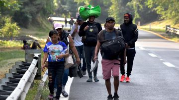 Migrant people take part in a caravan towards the border with the United States in Mapastepec, Chiapas state, Mexico on December 27, 2023. Hundreds of migrants left last Sunday in a caravan from the southern tip of Mexico, protesting against the "closeness" of local immigration authorities in providing them with transit permits to advance towards the United States, as witnessed by an AFP journalist. (Photo by STRINGER / AFP) (Photo by STRINGER/AFP via Getty Images)