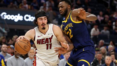 SAN FRANCISCO, CALIFORNIA - DECEMBER 28: Jaime Jaquez Jr. #11 of the Miami Heat is guarded by Andrew Wiggins #22 of the Golden State Warriors in the second half at Chase Center on December 28, 2023 in San Francisco, California. NOTE TO USER: User expressly acknowledges and agrees that, by downloading and or using this photograph, User is consenting to the terms and conditions of the Getty Images License Agreement. (Photo by Ezra Shaw/Getty Images)