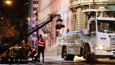 SYDNEY, AUSTRALIA - MARCH 29: A camera crew prepare to film a scene on the streets of Sydney during production of the film sequel Mask II March 29, 2004 in Sydney, Australia. Major streets were shut down in the city's CBD for a scene involving the Mask being chased by his enemies. (Photo by Cameron Spencer/Getty Images)