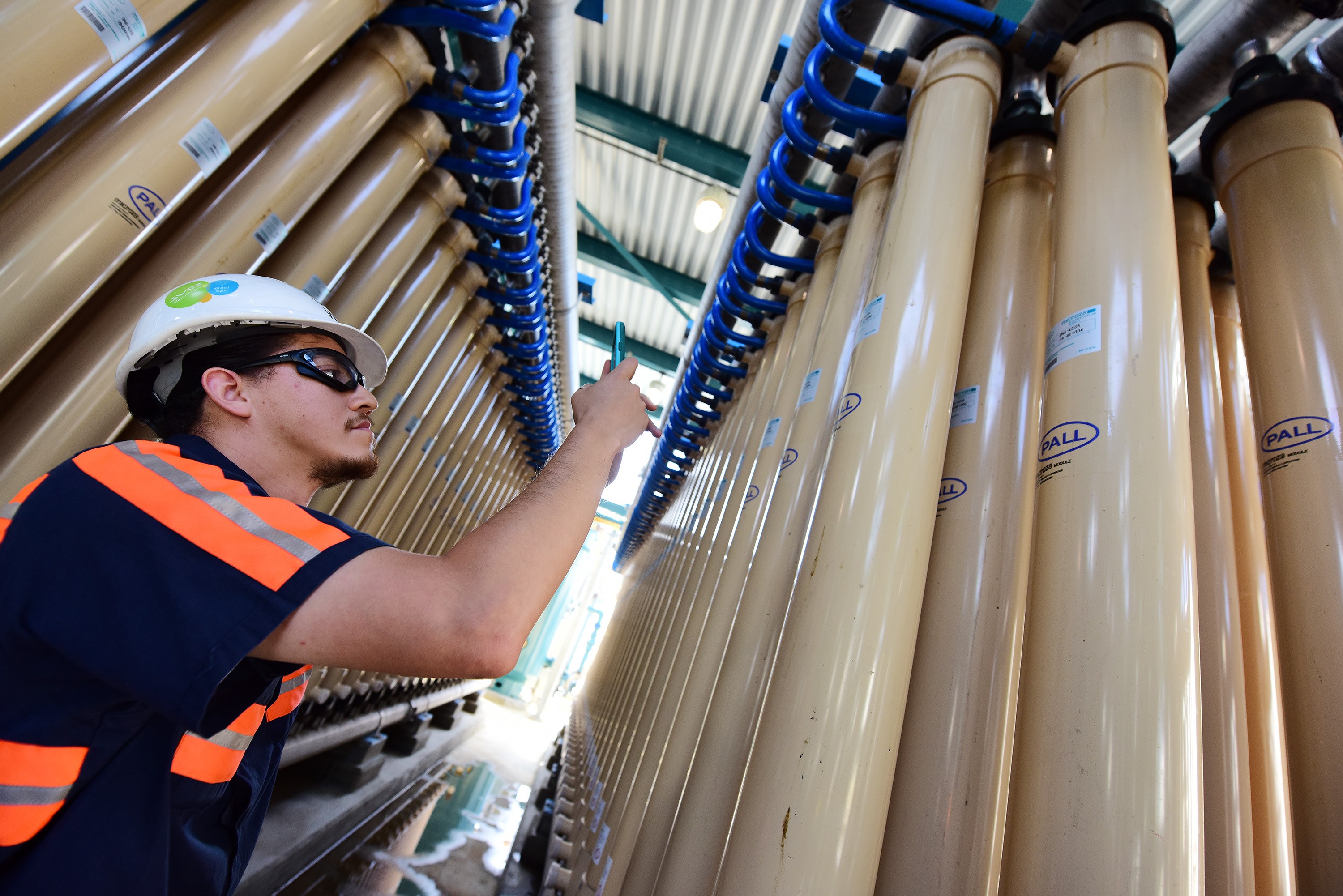 Technician Erick Torres examines micro filter membranes at the West Basin Municipal Water District (WBMWD) water recycling facility in El Segundo, California, September 14, 2015. As drought-stricken California struggles with water conservation, West Basin employs a three-part water purification system involving microfiltration, reverse osmosis and ultraviolet light treatment to transform waste water into potable water. The finished product is then sent underground to replenish the areas aquifers where it mixes with the natural underground water supply which feeds wells. Critics call the method toilet to tap but the final product is more pure than tap or bottled water and exceeds all state and federal drinking water standards according to WBMWD. AFP PHOTO / ROBYN BECK. AFP PHOTO / ROBYN BECK (Photo credit should read ROBYN BECK/AFP via Getty Images)