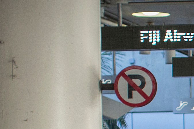 LOS ANGELES, CA - FEBRUARY 04: International travelers pass police officers keeping demonstrators and counter demonstrators apart during protests in support of a ruling by a federal judge in Seattle that grants a nationwide temporary restraining order against the presidential order to ban travel to the United States from seven Muslim-majority countries, at Tom Bradley International Terminal at Los Angeles International Airport on February 4, 2017 in Los Angeles, California. (Photo by David McNew/Getty Images)