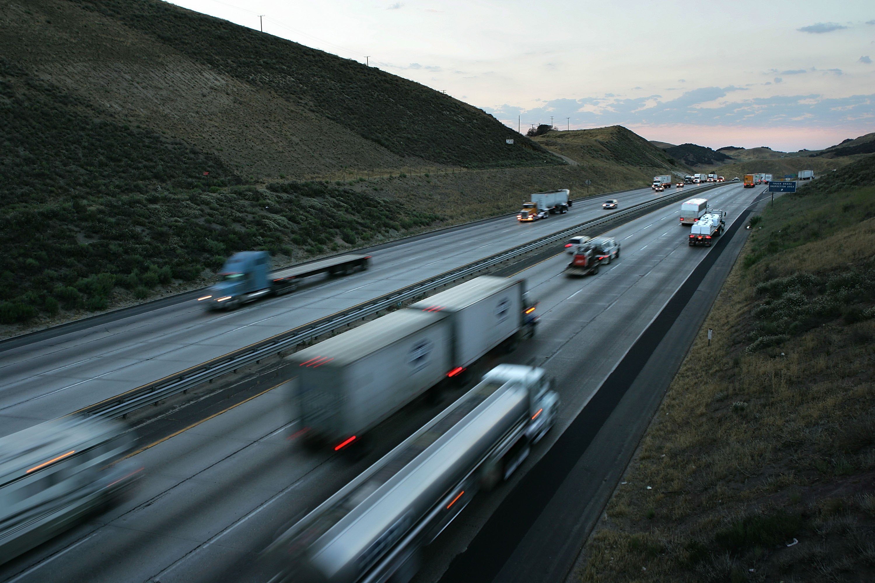 GORMAN, CA - JUNE 30: Trucks cross the San Andreas Fault at Tejon Pass between Los Angeles and northern California, Interstate 5, on June 30, 2006 near Gorman, California. Scientists are warning that after more than 300 years, the southern end of the 800-mile-long San Andreas Fault north and east of Los Angeles has built up immense pressure that could trigger a massive earthquake at any time. Such a quake could produce a sudden lateral movement of 23 to 32 feet which would be would be among the largest ever recorded. By comparison, the 1906 earthquake at the northern end of the fault destroyed San Francisco with a movement of no more than about 21 feet. Experts believed that a quake of magnitude-7.6 or greater on the lower San Andreas could kill thousands of people in the Los Angeles area with damages running into the tens of billions of dollars. (Photo by David McNew/Getty Images)
