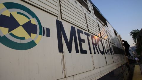 CHATSWORTH, CA - SEPTEMBER 15: A conductor steps down from the engine of a Metrolink train on the Los Angeles-bound Monday morning commute as service partially resumes for the first time since the September 12 head-on collision of a Metrolink commuter train with a freight train September 15, 2008 in Chatsworth, California. Twenty-four people were killed in the crash and a 25th has died in a hospital. Ninety-five of the 222 passengers were critically or seriously injured. Metrolink has blamed a Metrolink engineer who was killed in the crash for not stopping for a red light so the freight train could pass on a parallel track. It was the worst rail disaster in Metrolink history and worst in the U.S. for 15 years. (Photo by David McNew/Getty Images)