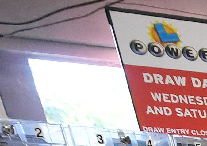 Customers buy Mega Millions tickets hours before the draw of the USD 1 billion jackpot, at the Bluebird Liquor store in Torrance, California on October 19, 2018. (Photo by Mark RALSTON / AFP) (Photo credit should read MARK RALSTON/AFP via Getty Images)