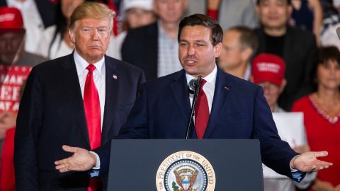 PENSACOLA, FL - NOVEMBER 03: Florida Republican gubernatorial candidate Ron DeSantis speaks with U.S. President Donald Trump at a campaign rally at the Pensacola International Airport on November 3, 2018 in Pensacola, Florida. President Trump is campaigning in support of Republican candidates in the upcoming midterm elections. (Photo by Mark Wallheiser/Getty Images)