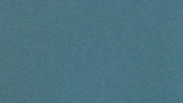 A woman holds a cut half of a plant-based patty with a meaty taste, made and cooked by a robot according to customer requirements, offered by Israeli fast food brand BBB in the Israeli coastal town of Herzliya on December 28, 2021. - The Israeli fast food restaurant BBB is serving up a veggie steak made and cooked by a robot that tailors ingredients and cooking time to customer tastes. Customers can use an app to choose the amount of vegetable protein or fat in their "steak", as well as its size and how they want it cooked, she said. The "robot chef", which is the size of a large oven, can make three different steaks simultaneously -- though a human staff member makes up the burgers. (Photo by JACK GUEZ / AFP) (Photo by JACK GUEZ/AFP via Getty Images)