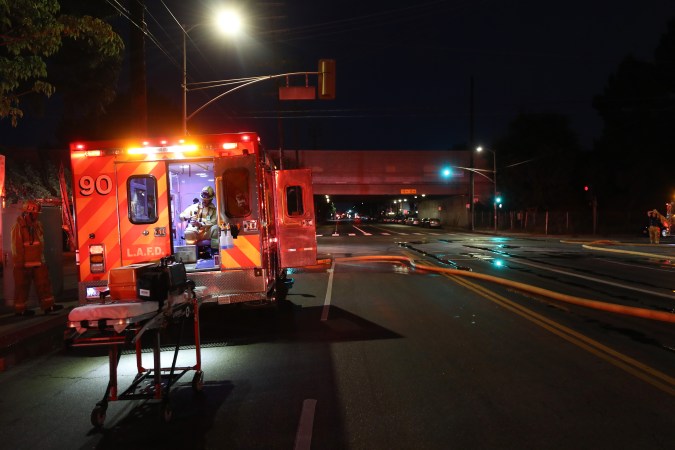 VAN NUYS, CALIFORNIA - JUNE 01: A firefighter works in the aftermath of a blaze set during looting of shops at a strip mall amid demonstrations over George Floyd’s death on June 1, 2020 in Van Nuys, California. California Governor Gavin Newsom has deployed National Guard troops to Los Angeles County to curb unrest which occurred amid some demonstrations. Former Minneapolis police officer Derek Chauvin was taken into custody for Floyd's death and charged with third-degree murder. (Photo by Mario Tama/Getty Images)