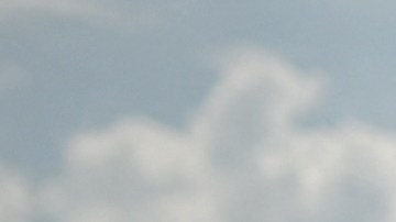 A lifeguard takes a drink as people swim in an outside pool at Hathersage Swimming Pool, west of Sheffield in northern England on July 18, 2022, during an extreme heat wave. Britain could hit 40 Celsius (104 Fahrenheit) for the first time, forecasters said, causing havoc in a country unprepared for the onslaught of extreme heat that authorities said was putting lives at risk. (Photo by Oli SCARFF / AFP) / -- IMAGE RESTRICTED TO EDITORIAL USE - STRICTLY NO COMMERCIAL USE -- (Photo by OLI SCARFF/AFP via Getty Images)
