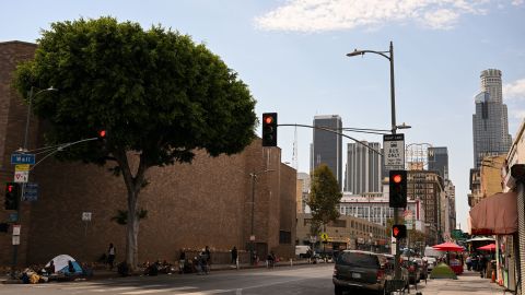 People camp in tents under a shady tree on the sidewalk near Skid Row during a heat wave in downtown Los Angeles, California on September 2, 2022. - A "dangerous" heat wave has taken hold of the southwestern US. Forecasters said the mercury could reach as high as 112 Fahrenheit (44 Celsius) in the densely populated Los Angeles suburbs as a heat dome settles in over parts of California, Nevada and Arizona. (Photo by Patrick T. FALLON / AFP) (Photo by PATRICK T. FALLON/AFP via Getty Images)