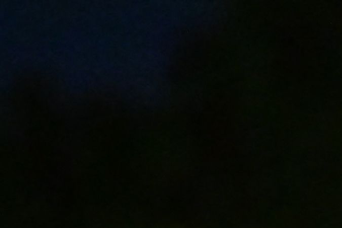 People hold candles as they pay tribute to the victims of the mass shooting at a candlelight vigil in front of City Hall in Monterey Park, California, Jan. 24, 2023. - Huu Can Tran, the 72-year-old Asian immigrant who killed 11 people before shooting himself as police moved in on him; was once a regular at the California dance club where a tragic gun massacre unfolded. Tran used a semi-automatic pistol to spray 42 bullets around the Star Ballroom Dance Studio in Monterey Park, an Asian-majority city near Los Angeles. (Photo by Frederic J. Brown / AFP) (Photo by FREDERIC J. BROWN/AFP via Getty Images)