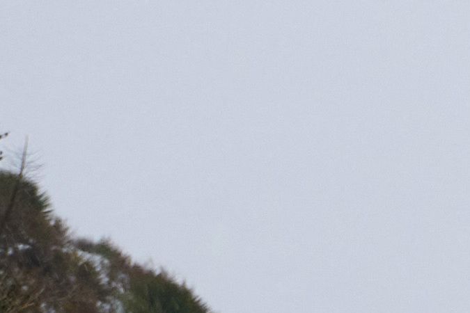 An SUV drives past an icy sign in the San Gabriel Mountains in the Angeles National Forest, California, on February 24, 2023. - Californians more used to flip flops and shorts were wrapping up warm Thursday as a rare winter blizzard, the first in more than 30 years, loomed over Los Angeles, even as the US East Coast basked in summer-like temperatures. (Photo by Allison Dinner / AFP) (Photo by ALLISON DINNER/AFP via Getty Images)