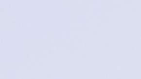 TOPSHOT - Houses sit below snow covered mountains in the Angeles National Forest in Sylmar, California, on February 25, 2023. - A major storm with a blizzard warning for parts of Southern California is expected to deliver damaging rain and snow at elevations lower than normal in Los Angeles County. (Photo by Allison Dinner / AFP) (Photo by ALLISON DINNER/AFP via Getty Images)