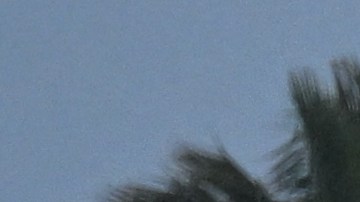 A person walks along Ballona Creek as storm water runoff from a winter rain storm flows into the Pacific Ocean in Marina Del Rey community of unincorporated Los Angeles County, California, on March 14, 2023. (Photo by Patrick T. Fallon / AFP) (Photo by PATRICK T. FALLON/AFP via Getty Images)