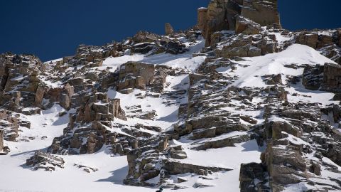 A skier makes fresh turns after hiking the East Wall at Arapahoe Basin in Summit County, Colorado on April 6, 2023. - Arapahoe Basin, located on the western side of the Continental Divide, has a base elevation of 10,780 ft (3,286 m). With exceptional snow falling west of the Divide, several ski resorts from Colorado to California are anticipating extending ski seasons into the summer months. The elevated levels of the snowpack have led to hydrologists and climatologists forecasting that many reservoirs in the west will begin to rebound and partially fill after years of drought. (Photo by Jason Connolly / AFP) (Photo by JASON CONNOLLY/AFP via Getty Images)