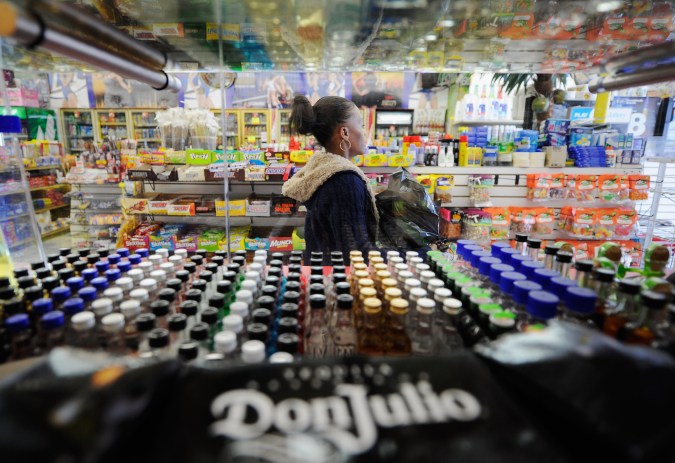 LOS ANGELES, CA - APRIL 27: A customer walks out of Tom Liquor store located at the intersection of Florence and Normandy Avenues helps a customer in South Los Angeles on April 27, 2012 in Los Angeles, California. The intersection was the scene of the beating of truck driver Reginald Denny on April 29, 1992 during the early stages of the Los Angeles riots. It’s been 20 years since the Rodney King verdict that sparked the riots. (Photo by Kevork Djansezian/Getty Images)