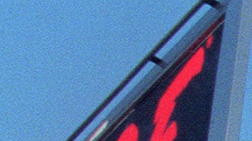 A resident and a cameraman look at damage to the Kaiser Permanente Building following the Northridge earthquake, on January 17, 1994. The earthquake measured 6.6 on the Richter scale and was centered in the San Fernando Valley. (Photo by HAL GARB / AFP) (Photo by HAL GARB/AFP via Getty Images)
