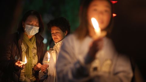 SAN FRANCISCO, CALIFORNIA - JANUARY 26: People hold candles during a candlelight vigil for the victims of the recent mass shootings in Monterey Park and Half Moon Bay on January 26, 2023 in San Francisco, California. Hundreds of people attended a candlelight vigil to honor the victims of back-to-back mass shootings in northern and southern California this past week. 18 people were shot and killed in the separate events. (Photo by Justin Sullivan/Getty Images)