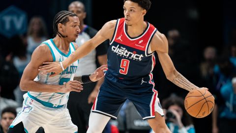 CHARLOTTE, NORTH CAROLINA - NOVEMBER 08: Nick Smith Jr. #8 of the Charlotte Hornets guards Ryan Rollins #9 of the Washington Wizards in the fourth quarter during their game at Spectrum Center on November 08, 2023 in Charlotte, North Carolina. NOTE TO USER: User expressly acknowledges and agrees that, by downloading and or using this photograph, User is consenting to the terms and conditions of the Getty Images License Agreement. (Photo by Jacob Kupferman/Getty Images)