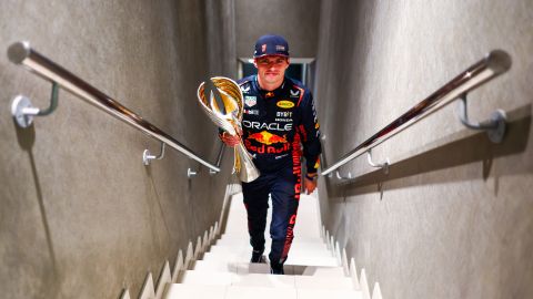 ABU DHABI, UNITED ARAB EMIRATES - NOVEMBER 26: Race winner Max Verstappen of the Netherlands and Oracle Red Bull Racing walks with his trophy in the Paddock after the F1 Grand Prix of Abu Dhabi at Yas Marina Circuit on November 26, 2023 in Abu Dhabi, United Arab Emirates. (Photo by Mark Thompson/Getty Images)