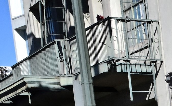 TOPSHOT - A homeless man sits on a luggage bag along a downtown Los Angeles street lined with tents housing the homeless on November 22, 2023 in Los Angeles, California, where skyrocketing rents in recent years has led to an increasing rise in the number of unhoused people. Some 75,500 people live on the streets of Los Angeles and its sprawling suburbs, according to a January survey. The figure is up 70 percent since 2015, in a city where sometimes shocking levels of inequality are on daily display. (Photo by Frederic J. BROWN / AFP) (Photo by FREDERIC J. BROWN/AFP via Getty Images)