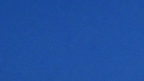 A man walks past tents housing the homeless on November 22, 2023 in Los Angeles, California, where skyrocketing rents in recent years has led to an increasing rise in the number of unhoused people. Some 75,500 people live on the streets of Los Angeles and its sprawling suburbs, according to a January survey. The figure is up 70 percent since 2015, in a city where sometimes shocking levels of inequality are on daily display. (Photo by Frederic J. BROWN / AFP) (Photo by FREDERIC J. BROWN/AFP via Getty Images)