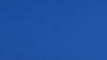 A man walks past tents housing the homeless on November 22, 2023 in Los Angeles, California, where skyrocketing rents in recent years has led to an increasing rise in the number of unhoused people. Some 75,500 people live on the streets of Los Angeles and its sprawling suburbs, according to a January survey. The figure is up 70 percent since 2015, in a city where sometimes shocking levels of inequality are on daily display. (Photo by Frederic J. BROWN / AFP) (Photo by FREDERIC J. BROWN/AFP via Getty Images)