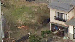 TOPSHOT - This aerial photo provided by Jiji Press shows smoke rising from a house fire (top R) along with other damage along the coast in the town of Noto, Ishikawa prefecture on January 2, 2024, a day after a major 7.5 magnitude earthquake struck the Noto region in Ishikawa prefecture. Japanese rescuers battled against the clock and powerful aftershocks on January 2 to find survivors of a major earthquake that struck on New Year's Day, killing at least 30 people and causing widespread destruction. (Photo by JIJI PRESS / AFP) / Japan OUT (Photo by STR/JIJI PRESS/AFP via Getty Images)