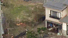 TOPSHOT - This aerial photo provided by Jiji Press shows smoke rising from a house fire (top R) along with other damage along the coast in the town of Noto, Ishikawa prefecture on January 2, 2024, a day after a major 7.5 magnitude earthquake struck the Noto region in Ishikawa prefecture. Japanese rescuers battled against the clock and powerful aftershocks on January 2 to find survivors of a major earthquake that struck on New Year's Day, killing at least 30 people and causing widespread destruction. (Photo by JIJI PRESS / AFP) / Japan OUT (Photo by STR/JIJI PRESS/AFP via Getty Images)
