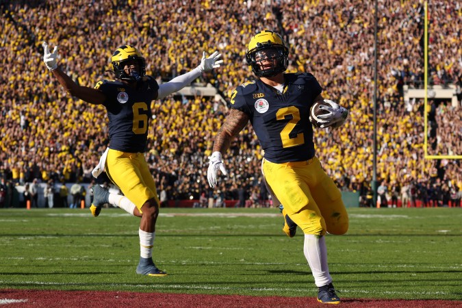 PASADENA, CALIFORNIA - JANUARY 01: Blake Corum #2 of the Michigan Wolverines scores a touchdown in the first quarter against the Alabama Crimson Tide during the CFP Semifinal Rose Bowl Game at Rose Bowl Stadium on January 01, 2024 in Pasadena, California. (Photo by Harry How/Getty Images)
