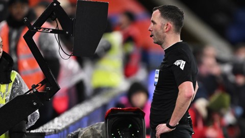 LONDON, ENGLAND - JANUARY 04: Match Referee, Chris Kavanagh checks VAR ahead of showing a red card to Dominic Calvert-Lewin of Everton (not pictured) during the Emirates FA Cup Third Round match between Crystal Palace and Everton at Selhurst Park on January 04, 2024 in London, England. (Photo by Mike Hewitt/Getty Images)