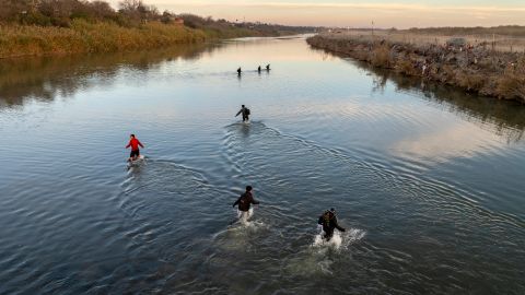 EAGLE PASS, TEXAS - JANUARY 07: In an aerial view, immigrants wade across the Rio Grande while crossing from Mexico into the United States on January 07, 2024 in Eagle Pass, Texas. According the a new report released by U.S. Department of Homeland Security, some 2.3 million migrants, mostly from families seeking asylum, have been released into the U.S. under the Biden Administration since 2021. (Photo by John Moore/Getty Images)