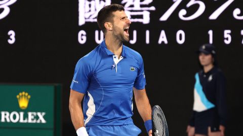 Serbia's Novak Djokovic celebrates a match point against Australia's Alexei Popyrin during their men's singles match on day four of the Australian Open tennis tournament in Melbourne on January 17, 2024. (Photo by David GRAY / AFP) / -- IMAGE RESTRICTED TO EDITORIAL USE - STRICTLY NO COMMERCIAL USE -- (Photo by DAVID GRAY/AFP via Getty Images)