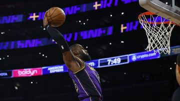 LOS ANGELES, CALIFORNIA - JANUARY 19: LeBron James #23 of the Los Angeles Lakers makes a slam dunk against the Brooklyn Nets in the first half at Crypto.com Arena on January 19, 2024 in Los Angeles, California. NOTE TO USER: User expressly acknowledges and agrees that, by downloading and/or using this photograph, user is consenting to the terms and conditions of the Getty Images License Agreement. (Photo by Ronald Martinez/Getty Images)