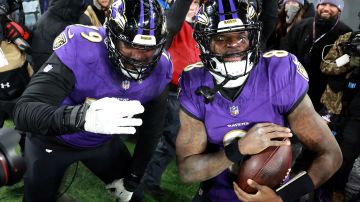 BALTIMORE, MARYLAND - JANUARY 20: Lamar Jackson #8 of the Baltimore Ravens celebrates with Ronnie Stanley #79 after scoring an 8 yard touchdown against the Houston Texans during the fourth quarter in the AFC Divisional Playoff game at M&T Bank Stadium on January 20, 2024 in Baltimore, Maryland. (Photo by Rob Carr/Getty Images)