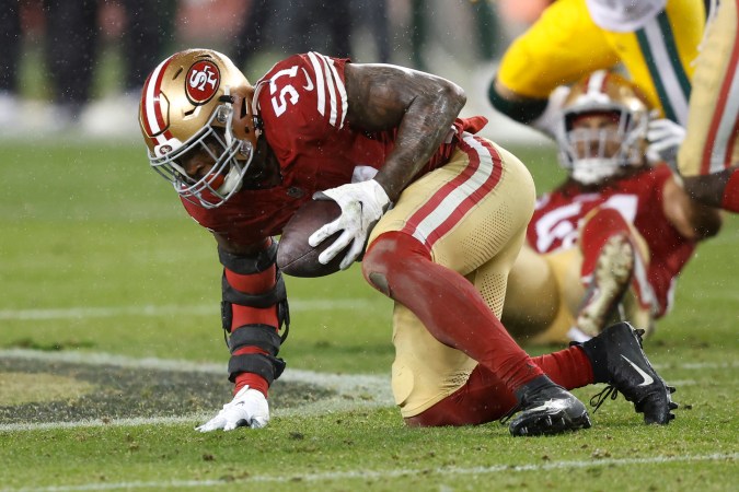 SANTA CLARA, CALIFORNIA - JANUARY 20: Dre Greenlaw #57 of the San Francisco 49ers intercepts a pass during the fourth quarter against the Green Bay Packers in the NFC Divisional Playoffs at Levi's Stadium on January 20, 2024 in Santa Clara, California. (Photo by Lachlan Cunningham/Getty Images)