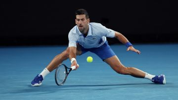 MELBOURNE, AUSTRALIA - JANUARY 21: Novak Djokovic of Serbia in action in their round four singles match against Adrian Mannarino of France during the 2024 Australian Open at Melbourne Park on January 21, 2024 in Melbourne, Australia. (Photo by Julian Finney/Getty Images)