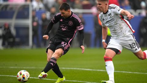 DALLAS, TEXAS - JANUARY 22: Lionel Messi #10 of Inter Miami CF shoots the ball ahead of Liam Fraser #18 of FC Dallas during the first half in the match between Inter Miami CF and FC Dallas at Cotton Bowl on January 22, 2024 in Dallas, Texas. (Photo by Sam Hodde/Getty Images)