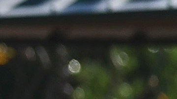 SAN DIEGO, CALIFORNIA - JANUARY 23: A person stands near a vehicle moved by flooding that remains lodged on a fence the day after an explosive rainstorm deluged areas of San Diego County on January 23, 2024 in San Diego, California. The intense rains forced dozens of rescues while flooding roadways and homes and knocking out electricity for thousands of residents. (Photo by Mario Tama/Getty Images)