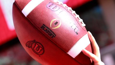 SALT LAKE CITY, UT - SEPTEMBER 10: A ball boy holds up a football during warm-ups before the Utah Utes and Brigham Young Cougars college football game at Rice Eccles Stadium on September 10, 2016 in Salt Lake City, Utah. (Photo by George Frey/Getty Images)