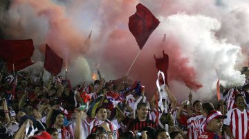 PASADENA, CA - SEPTEMBER 23: Fans of Chivas de Guadalajara celebrate a goal with smoke bombs and fireworks in the second half during the International Club Friendly match between Chivas de Guadalajara and Chivas USA at the Rose Bowl on September 23, 2009 in Pasadena, California. Chivas de Guadalajara defeated Chivas USA 2-0. (Photo by Victor Decolongon/Getty Images)