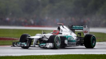 Germany's Michael Schumacher driving a Mercedes Formula 1 car during qualifying at the Silverstone circuit, England, Saturday, July 7, 2012. The Formula 1 teams make preparations ahead of the British Grand Prix at Silverstone circuit on Sunday. (AP Photo/Tim Hales)