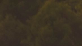 FILE - In this Thursday, Dec. 14, 2017, file photo provided by the Santa Barbara County Fire Department, flames from a back firing operation underway rise behind a home off Ladera Lane near Bella Vista Drive in Santa Barbara, Calif. The largest wildfire on record in California, the Thomas fire, was declared contained on Friday, Jan. 12, 2018, days after mud on the coastal mountain slopes it scorched crashed down on homes during a storm, killing at least 18 people. (Mike Eliason/Santa Barbara County Fire Department via AP, File)