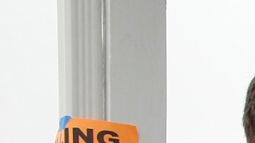 FILE - In this Tuesday, June 5, 2018 file photo, Peter Brubaker and his dog Albert arrive to cast his vote at a polling station inside the First Christian Church in Torrance, Calif. Early returns show turnout in California's Tuesday primary election was low. Counties are still receiving and counting ballots, which could ultimately make up a significant percentage of the total. (AP Photo/Damian Dovarganes, File)