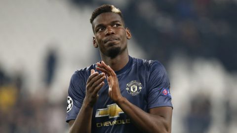 ManU midfielder Paul Pogba applauds fans at the end of the Champions League group H soccer match between Juventus and Manchester United at the Allianz stadium in Turin, Italy, Wednesday, Nov. 7, 2018. Manchester won 2-1. (AP Photo/Antonio Calanni)