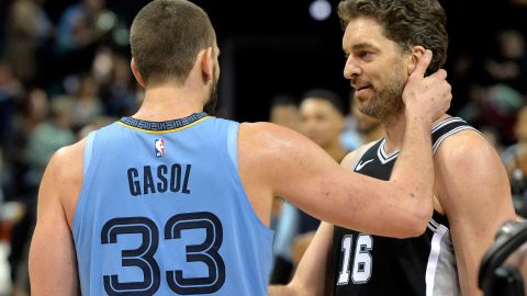 Memphis Grizzlies center Marc Gasol (33) greets his brother San Antonio Spurs center Pau Gasol (16) after an NBA basketball game Wednesday, Jan. 9, 2019, in Memphis, Tenn. (AP Photo/Brandon Dill)