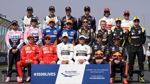 The drivers pose for a group photo ahead of the Australian Formula 1 Grand Prix in Melbourne, Australia, Sunday, March 17, 2019. (AP Photo/Andy Brownbill)